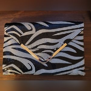 Bebe Silver sequence zebra clutch with strap